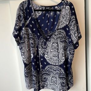 Navy and white short sleeved handkerchief print blouse with tie at the neck